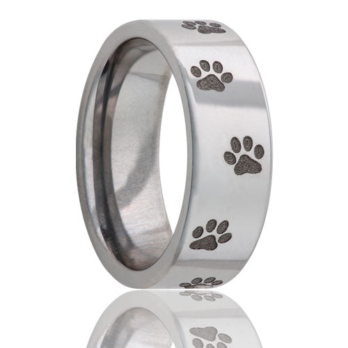 A paw print titanium wedding band displayed on a neutral white background.