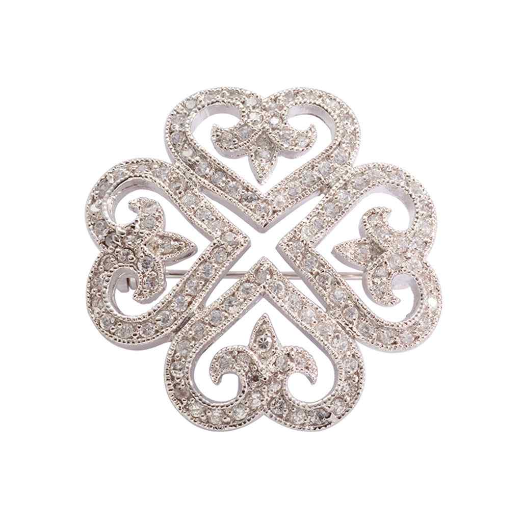 A clover pin with simulated diamonds displayed on a neutral white background.