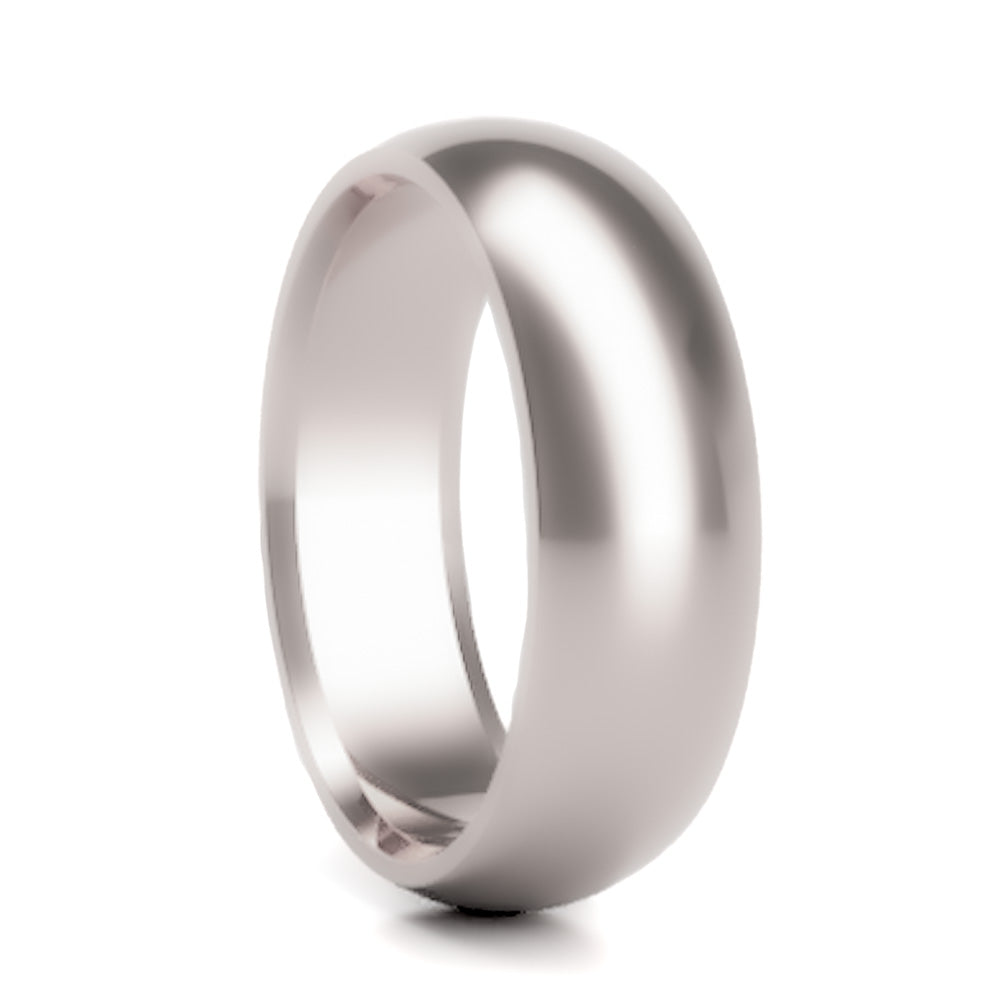 A domed 18k gold wedding band displayed on a neutral white background.
