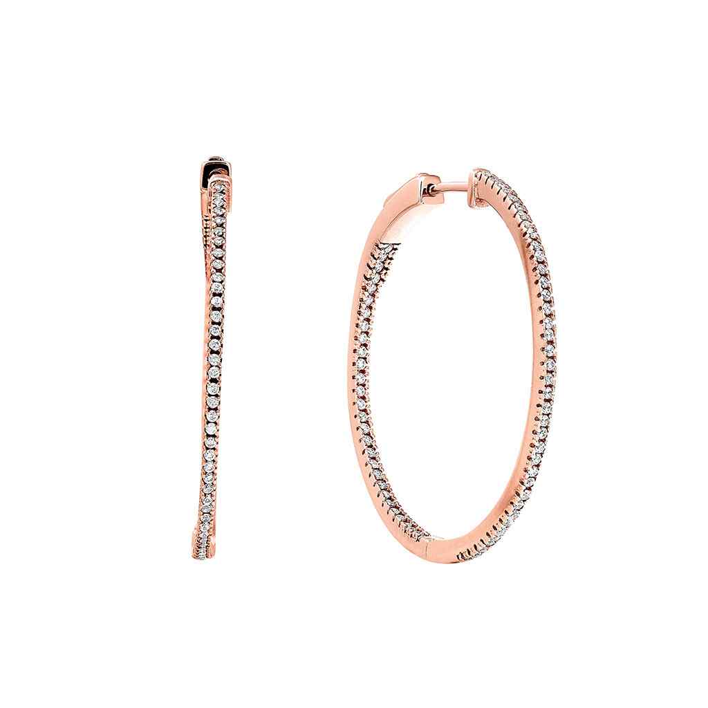 A inside out large hoop earrings with simulated diamonds displayed on a neutral white background.