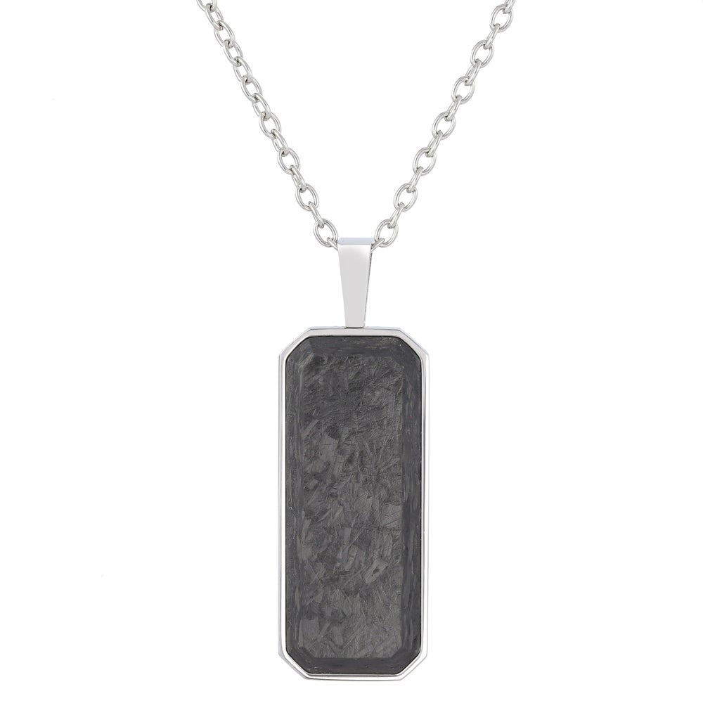 A stainless steel forged carbon dog tag on chain displayed on a neutral white background.