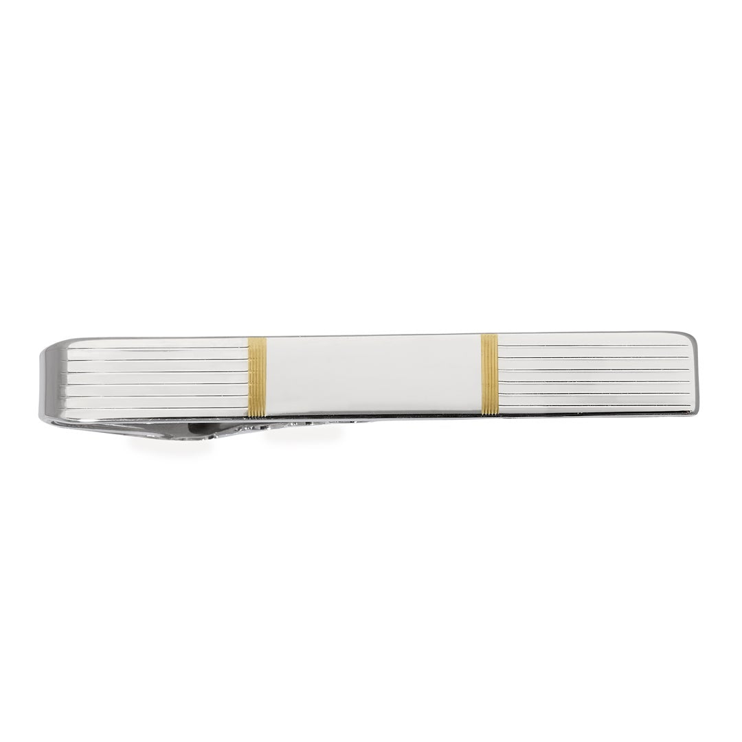 A sterling silver engine turned tie bar with gold accents displayed on a neutral white background.