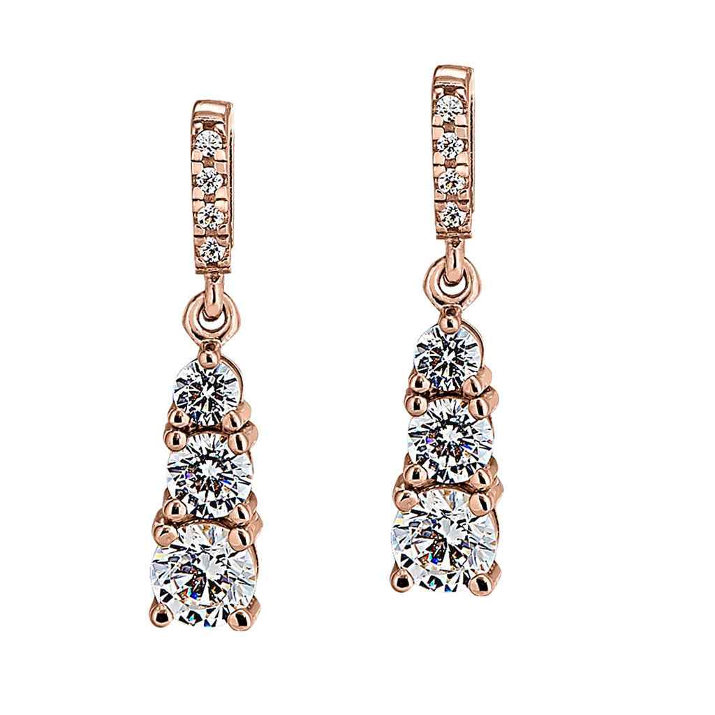 A three stone simulated diamonds drop earrings displayed on a neutral white background.