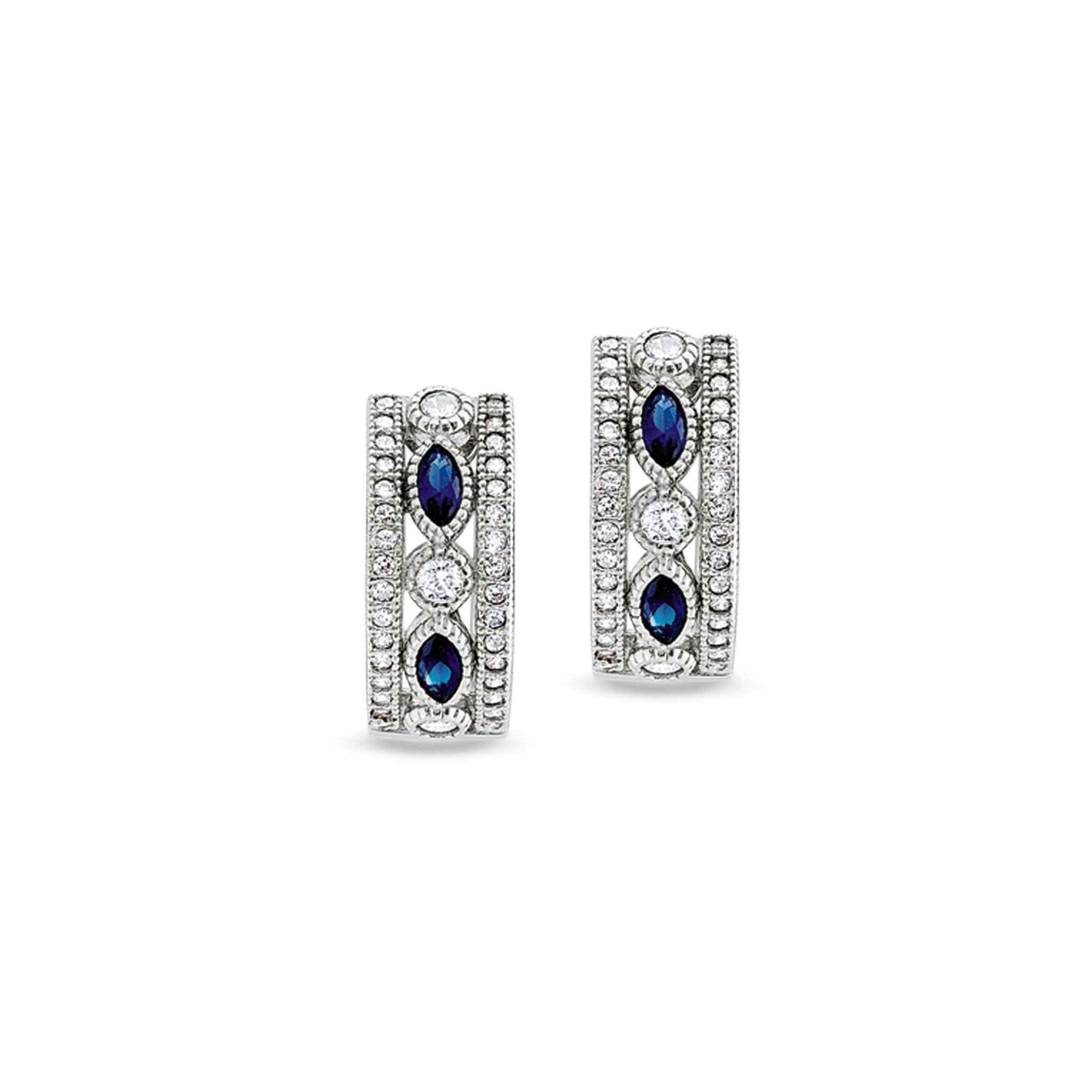 A vintage-style huggie earrings with synthetic blue sapphire & simulated diamonds displayed on a neutral white background.