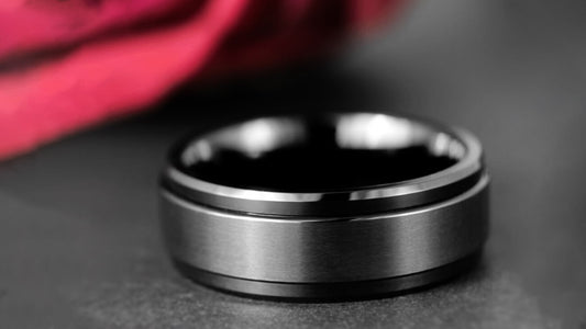 A black spinning ring near a floral arrangement.