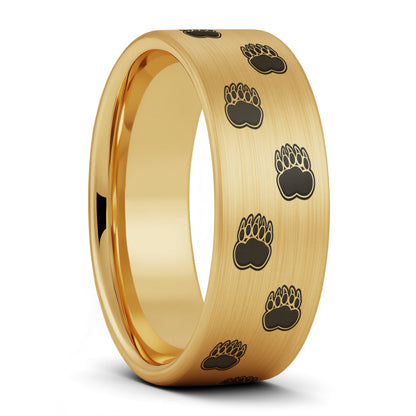 A bear paw print brushed gold tungsten men's wedding band displayed on a plain white background.
