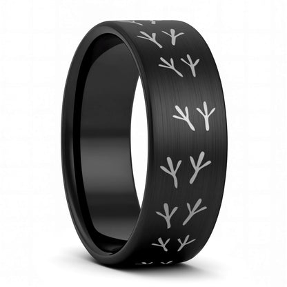 A bird tracks brushed black tungsten men's wedding band displayed on a plain white background.