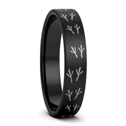 A bird tracks brushed black tungsten women's wedding band displayed on a plain white background.