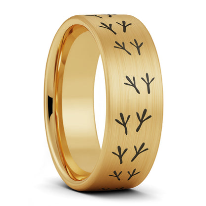 A bird tracks brushed gold tungsten men's wedding band displayed on a plain white background.