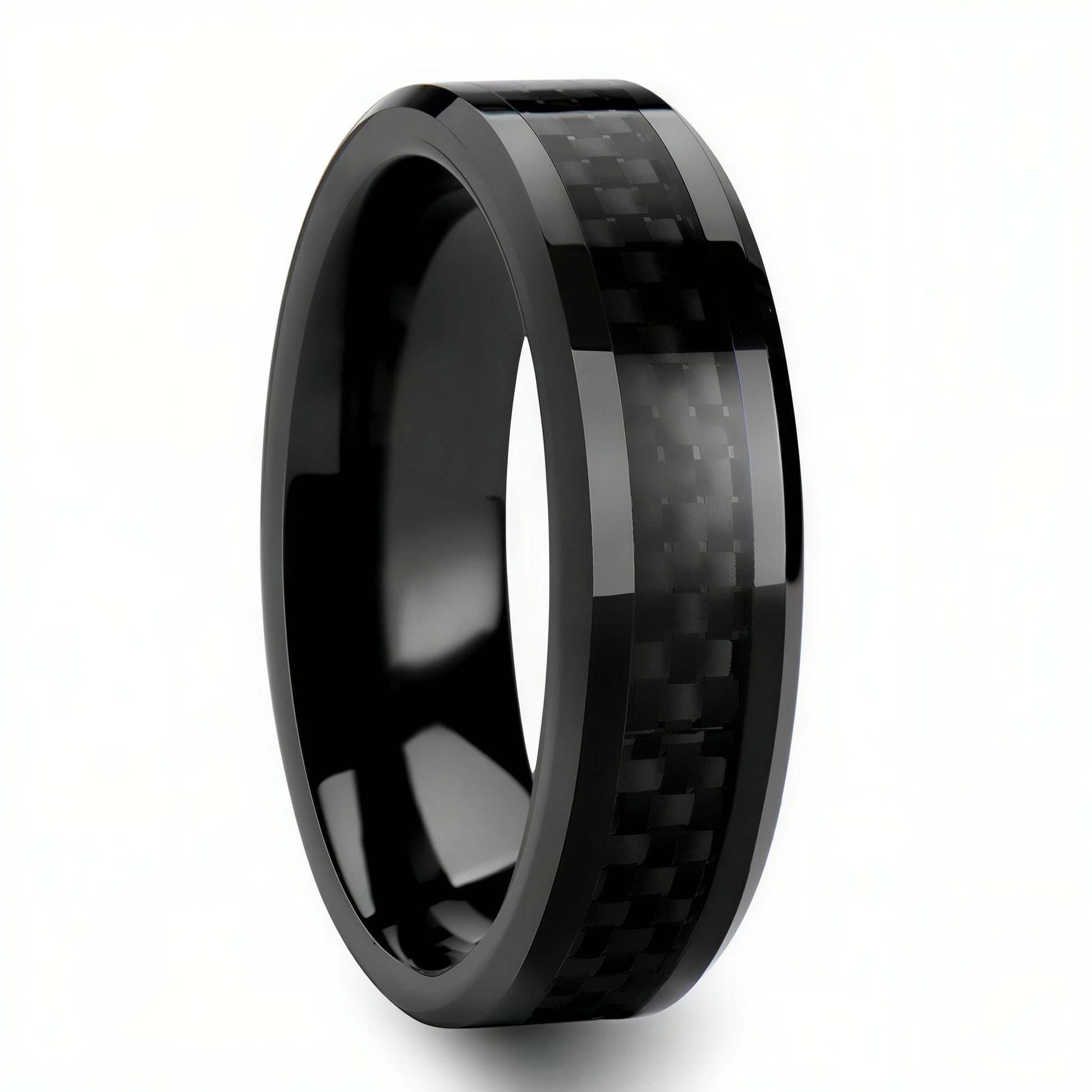 Black titanium ring with carbon fiber inlay on a white background