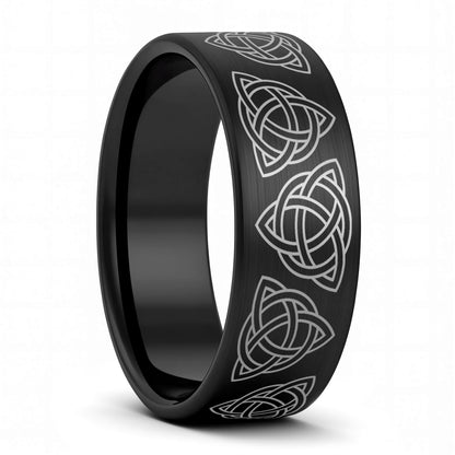 A celtic trinity knot brushed black tungsten men's wedding band displayed on a plain white background.