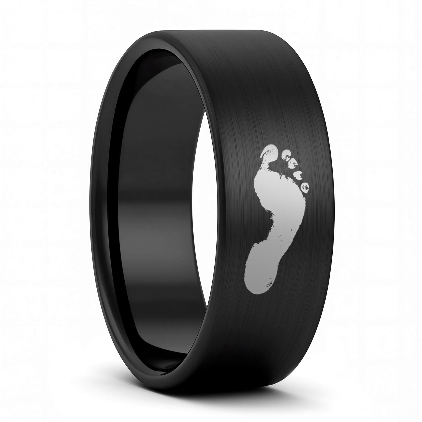 A custom footprint brushed black tungsten men's wedding band displayed on a plain white background.