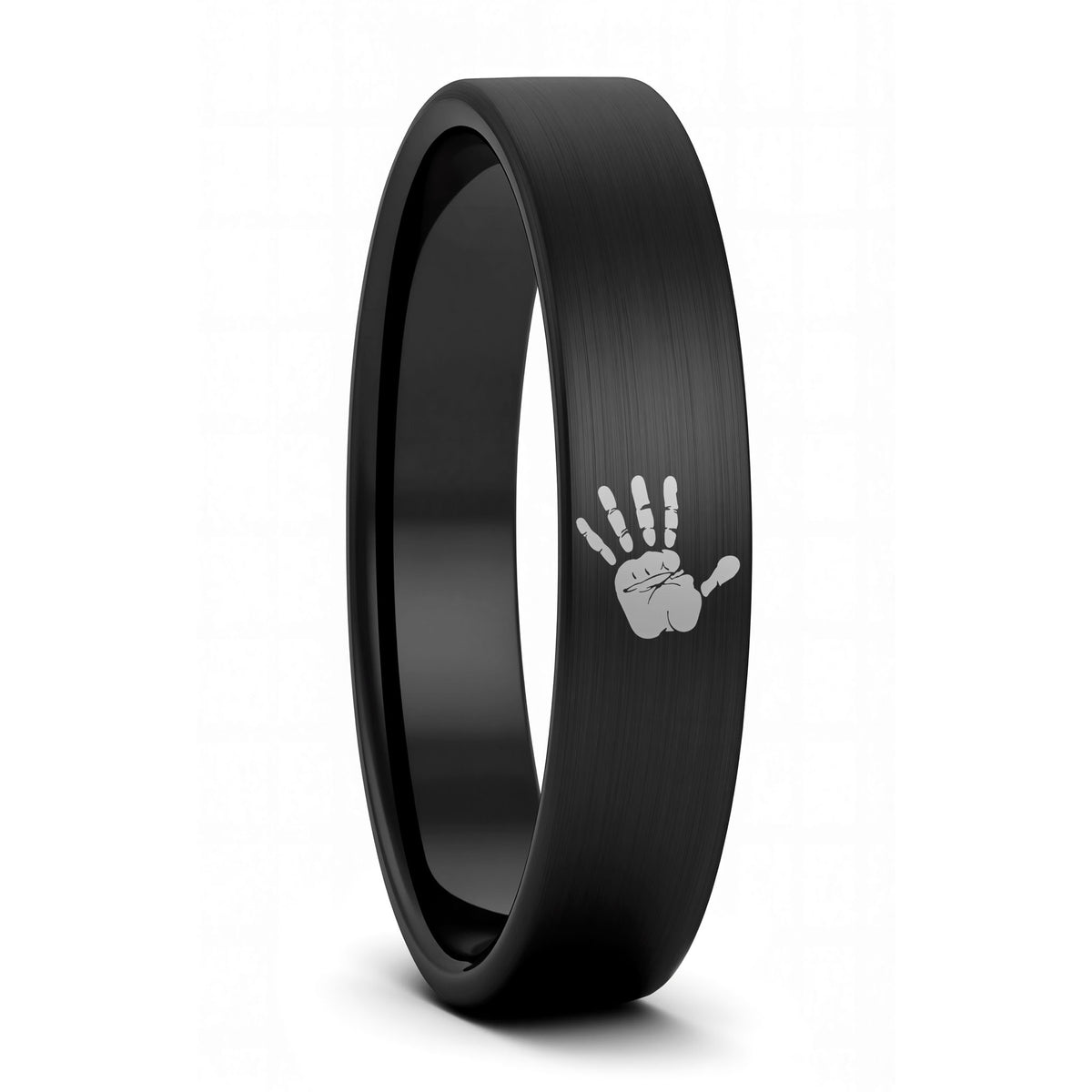 A custom handprint brushed black tungsten women's wedding band displayed on a plain white background.