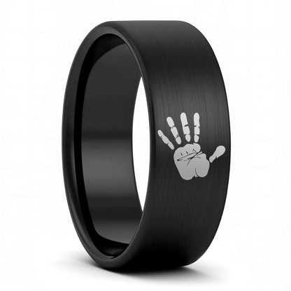 A custom handprint brushed black tungsten men's wedding band displayed on a plain white background.