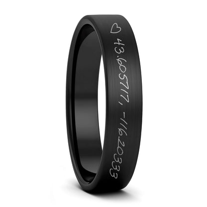 A custom handwritten coordinates brushed black tungsten women's wedding band displayed on a plain white background.