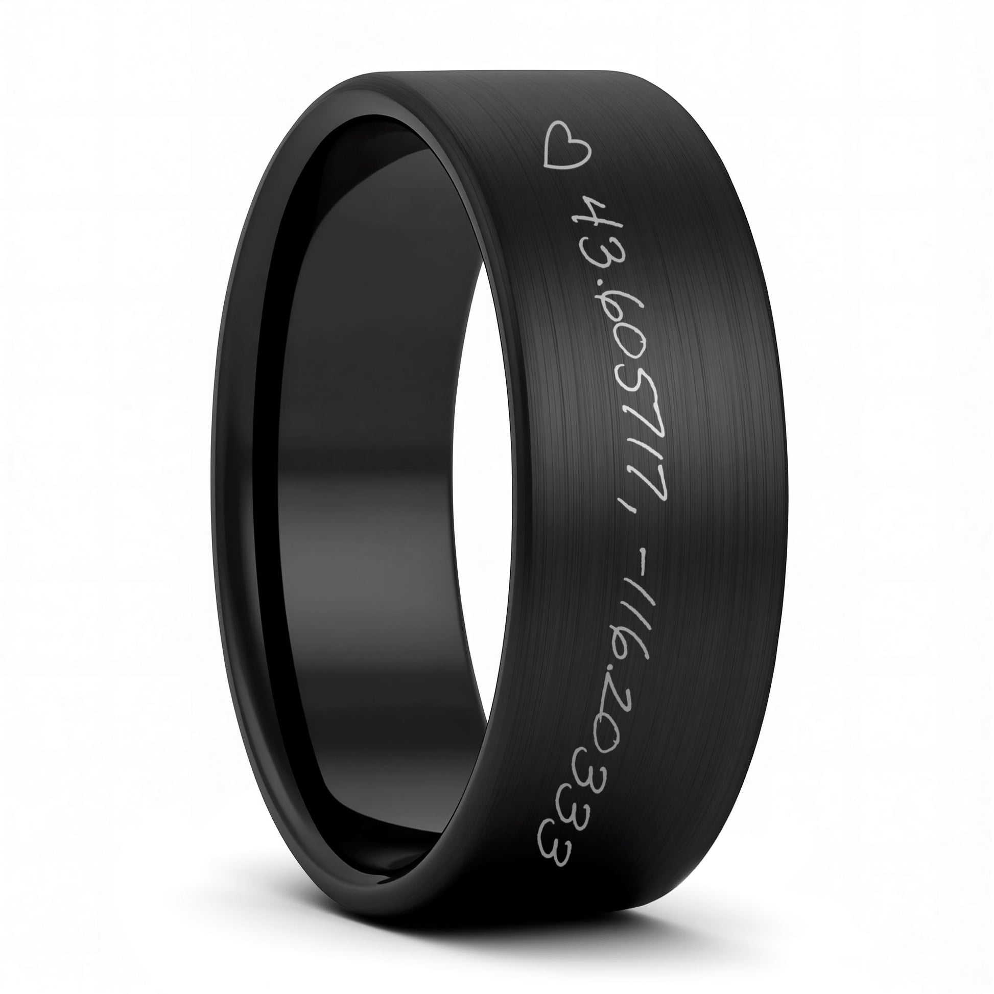 A custom handwritten coordinates brushed black tungsten men's wedding band displayed on a plain white background.