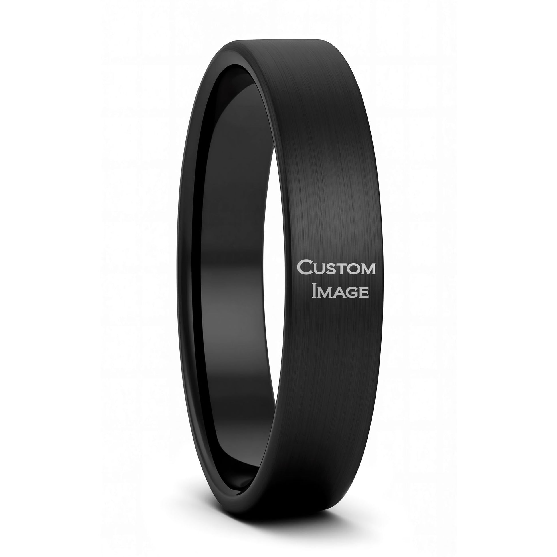 A custom image engraved brushed black tungsten women's wedding band displayed on a plain white background.