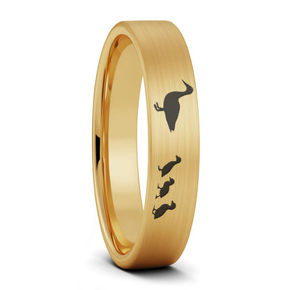 A duck ducklings brushed gold tungsten women's wedding band displayed on a plain white background.