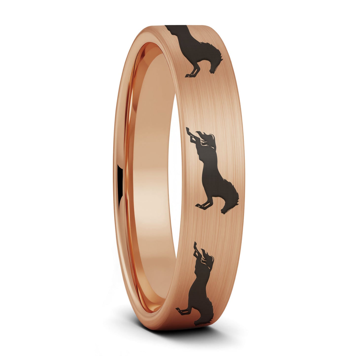 A galloping horses brushed rose gold tungsten women's wedding band displayed on a plain white background.