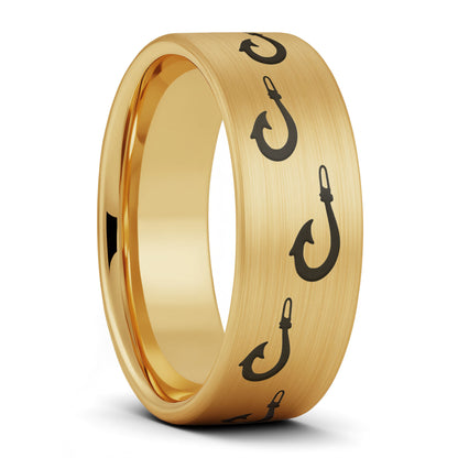 A polynesian fishing hook brushed gold tungsten men's wedding band displayed on a plain white background.