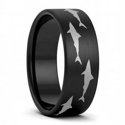 A shark brushed black tungsten men's wedding band displayed on a plain white background.