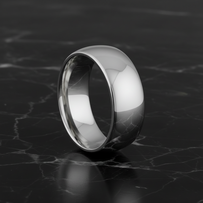 Tungsten ring on a dark marble surface