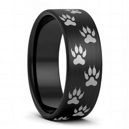 A wolf tracks brushed black tungsten men's wedding band displayed on a plain white background.