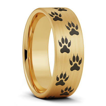 A wolf tracks brushed gold tungsten men's wedding band displayed on a plain white background.