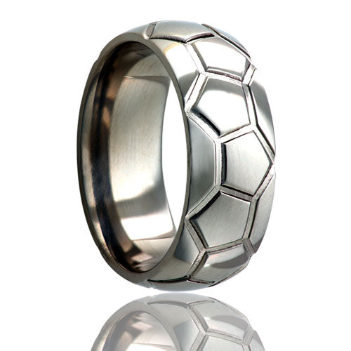A soccer ball pattern domed titanium wedding band displayed on a neutral white background.