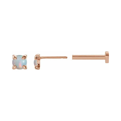 A 14k gold round white opal flat back earrings displayed on a neutral white background.
