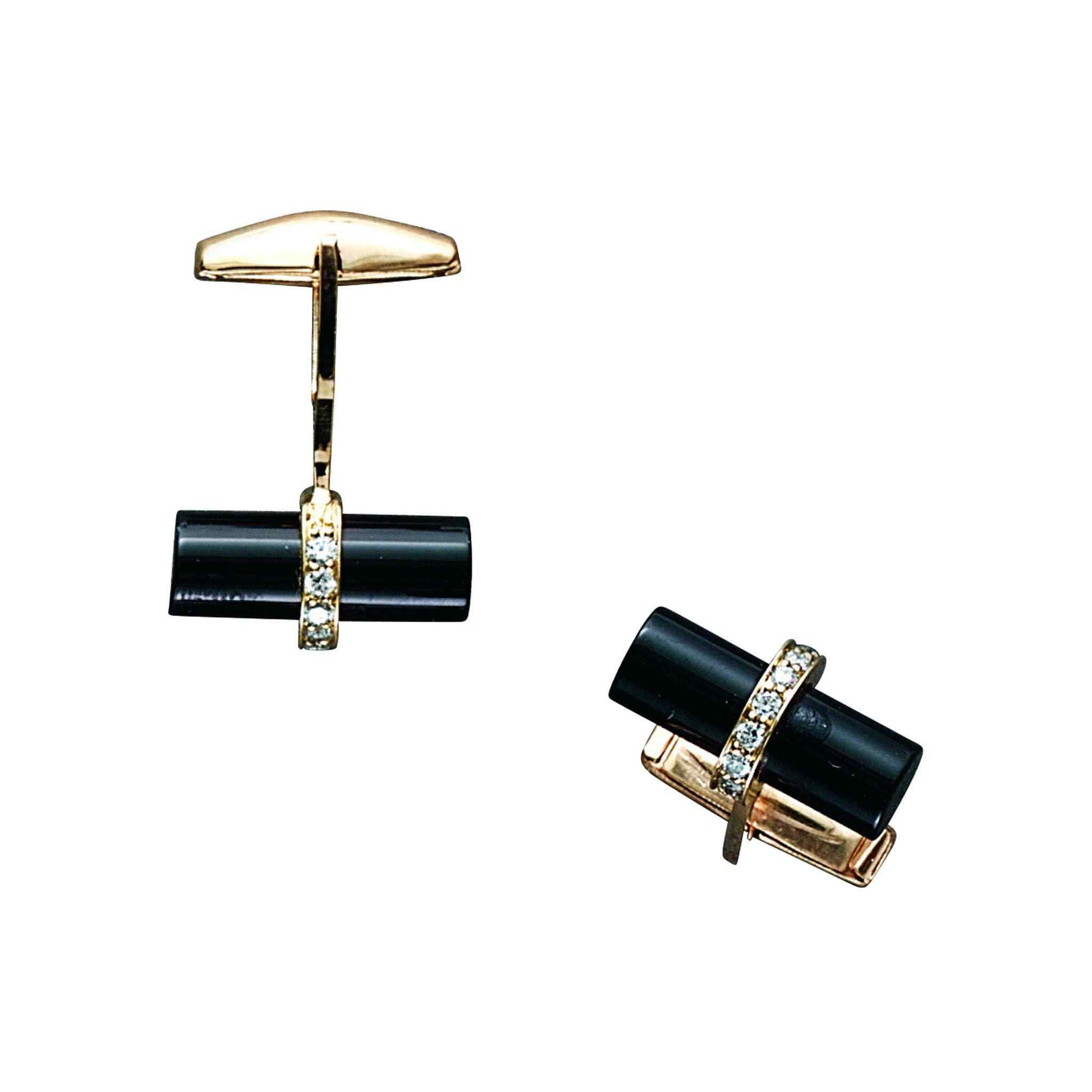 A 14k yellow gold cylinder onyx & diamond cufflinks with .48ctw displayed on a neutral white background.
