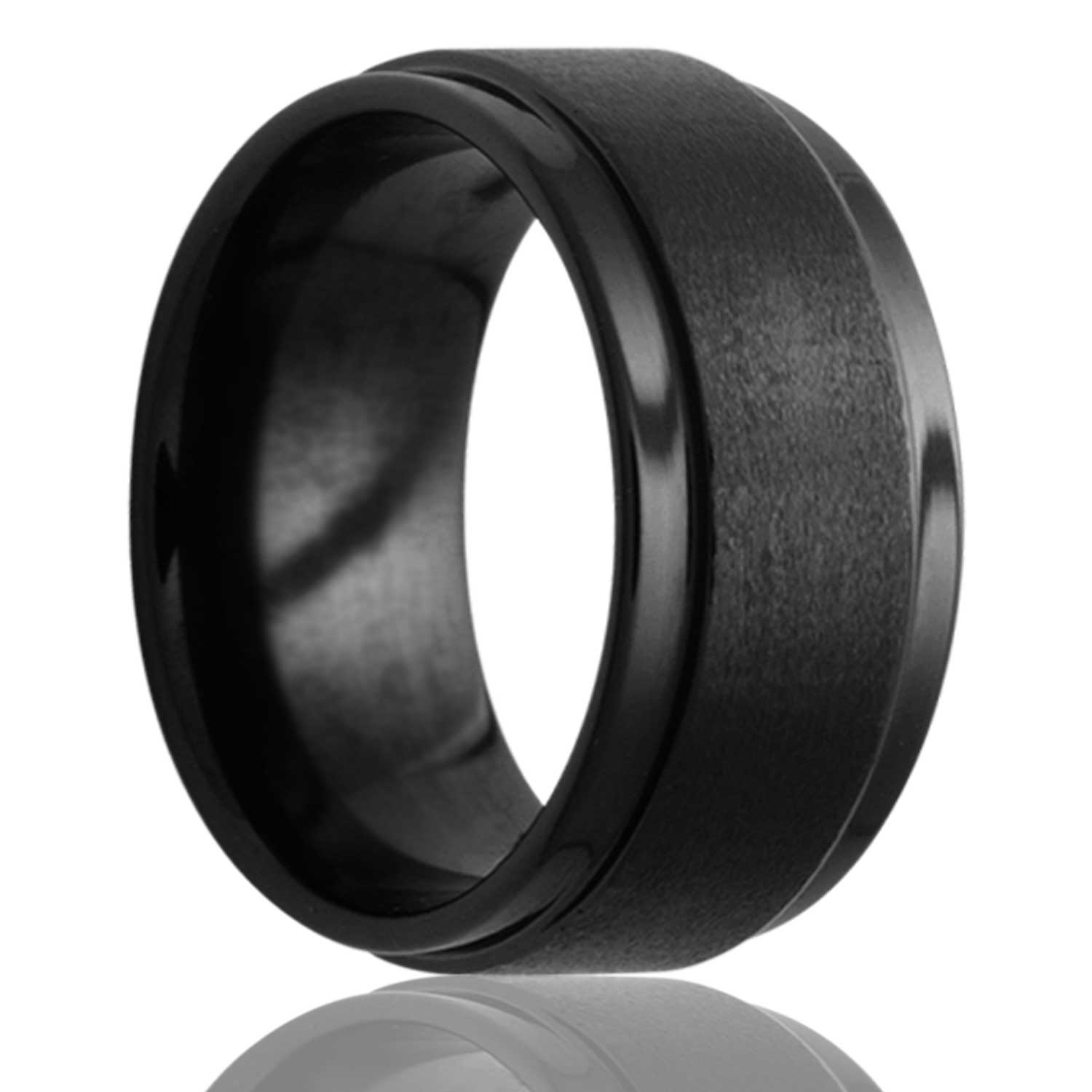 A satin finish black ceramic men's wedding band with stepped edges displayed on a neutral white background.