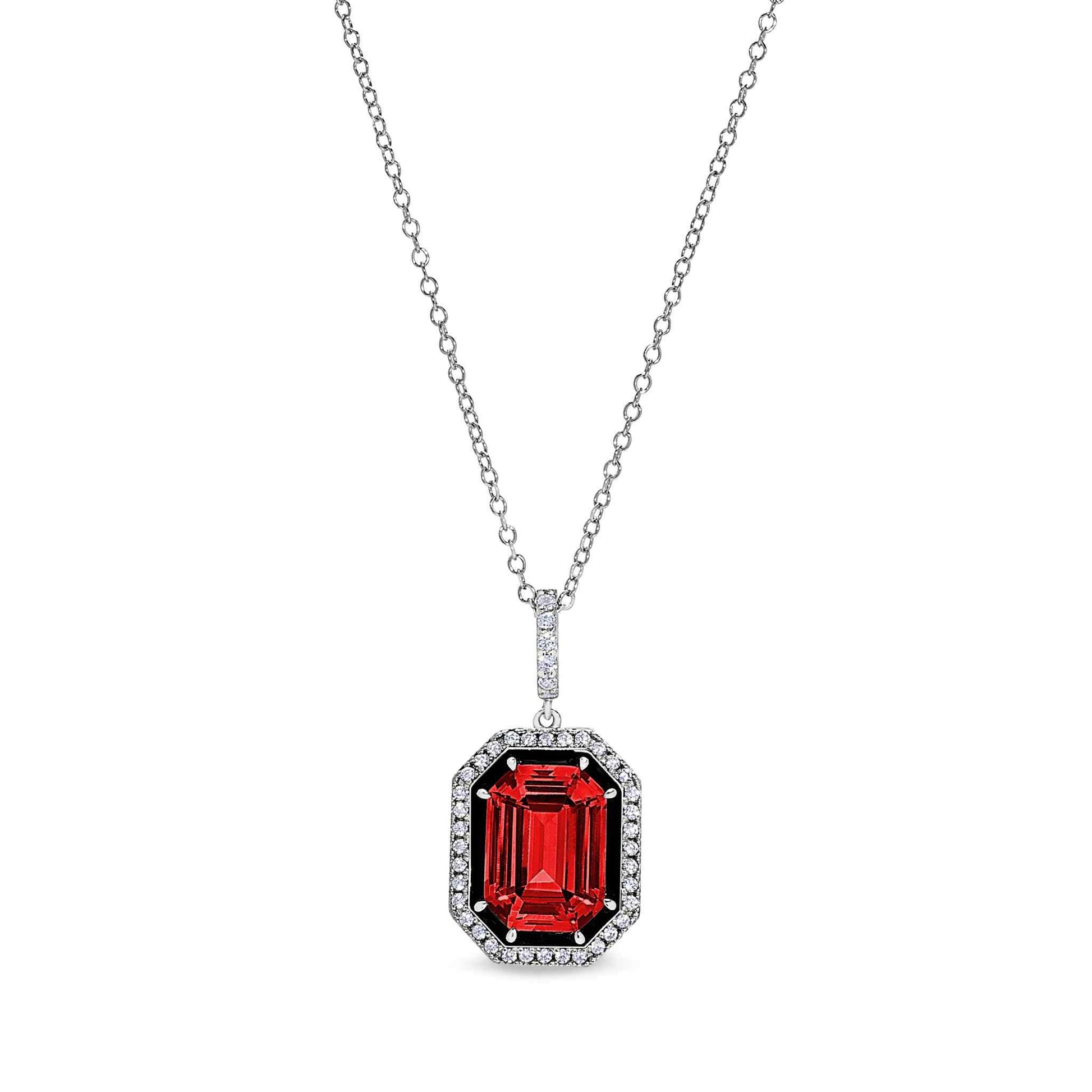 A black enamel & simulated ruby octagon pendant with simulated diamonds displayed on a neutral white background.