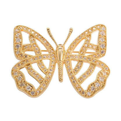 A butterfly pin with simulated diamond displayed on a neutral white background.