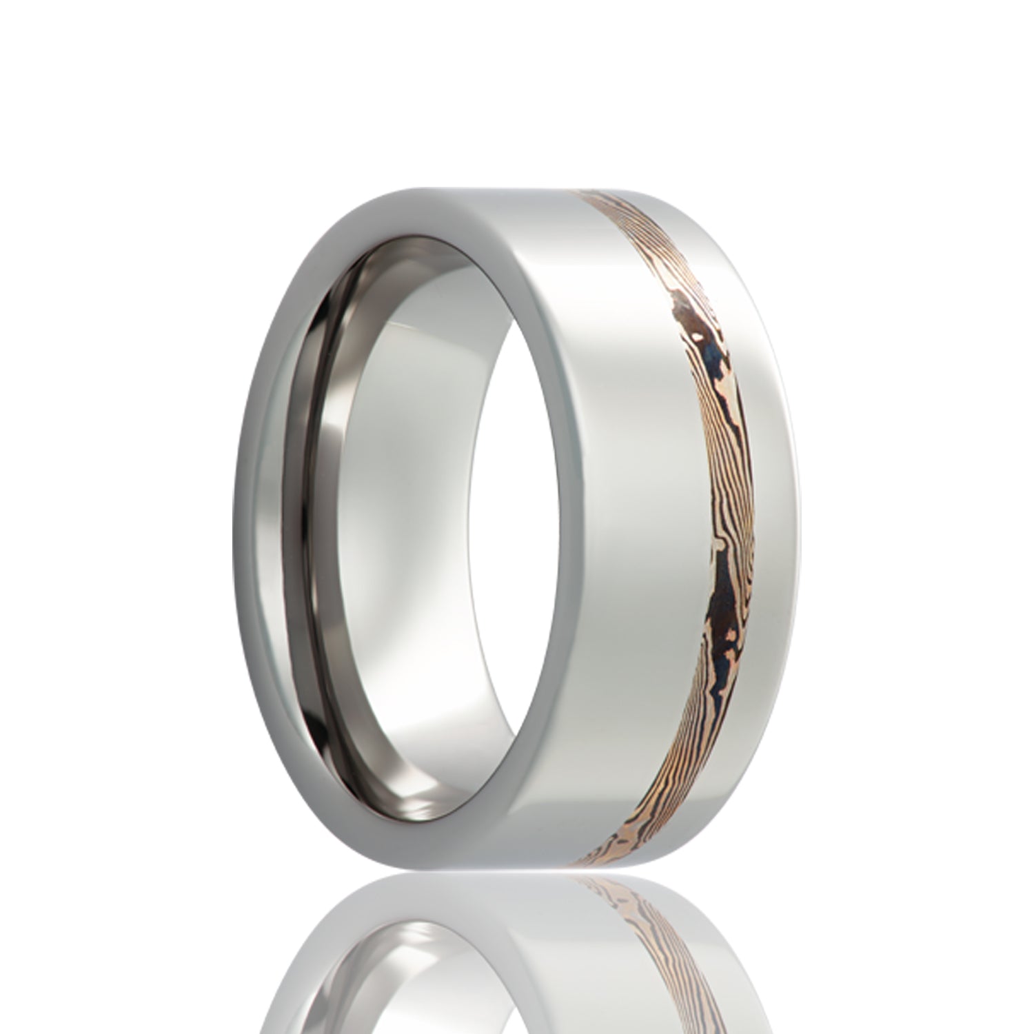 A asymmetrical 14k white gold & shakudo mokume gane inlay cobalt wedding band displayed on a neutral white background.