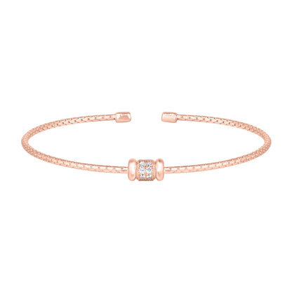 A cable bracelet with circular bar accent and simulated diamonds displayed on a neutral white background.