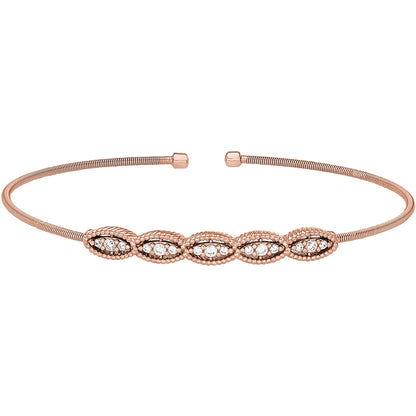 A cable bracelet with marquise shaped simulated diamond displayed on a neutral white background.