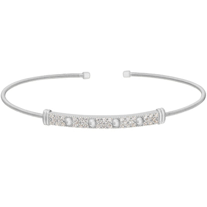 A cable bracelet with beaded gemstone accent bar displayed on a neutral white background.
