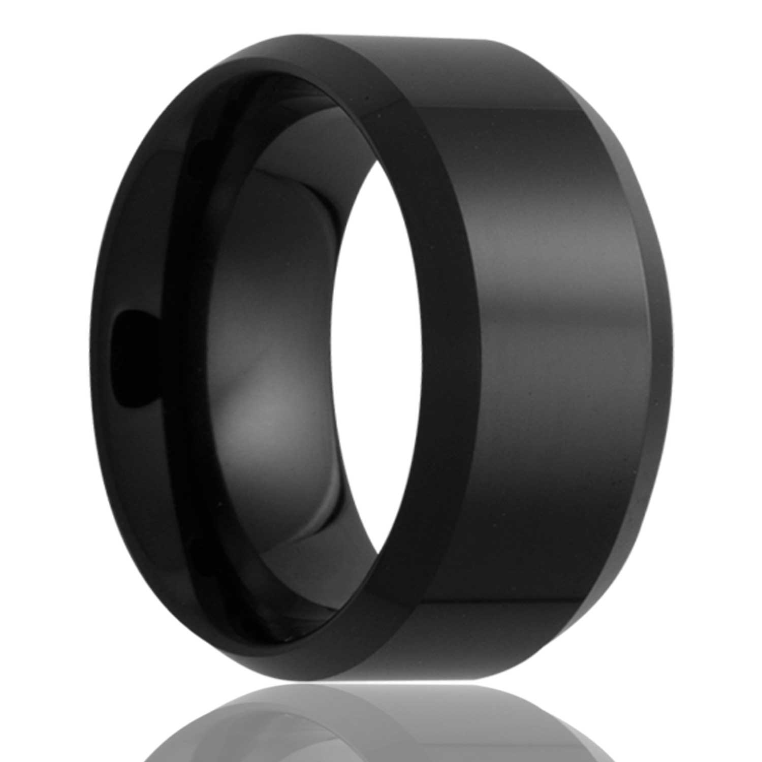 A black ceramic wedding band with beveled edges displayed on a neutral white background.