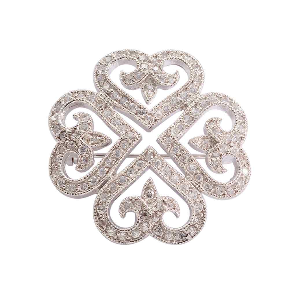 A clover pin with simulated diamonds displayed on a neutral white background.