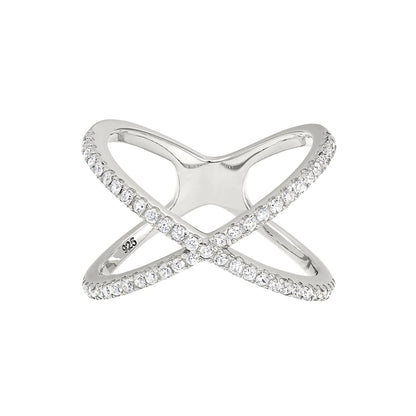 A criss cross negative space women's ring with simulated diamonds displayed on a neutral white background.