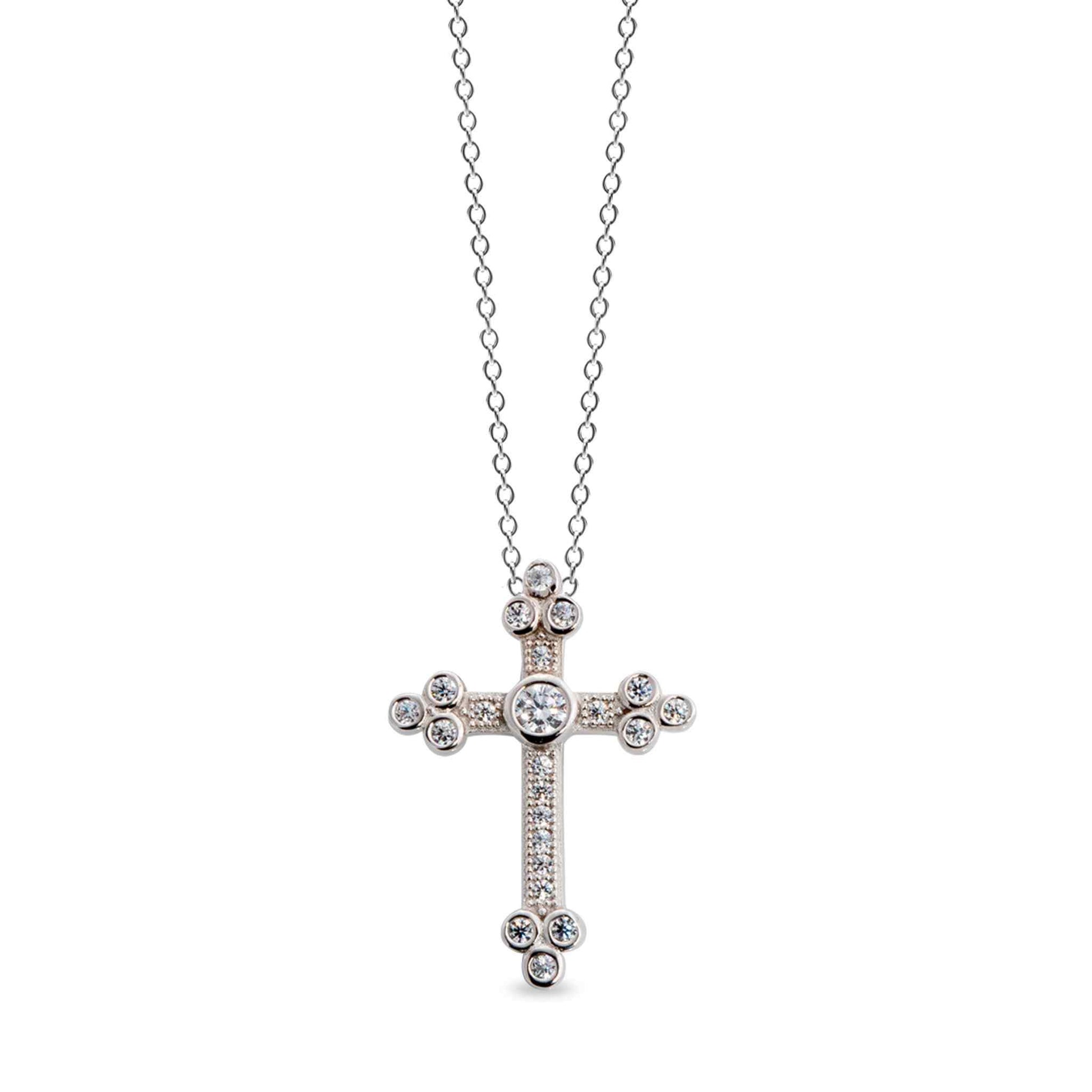 A cross necklace with simulated diamonds displayed on a neutral white background.