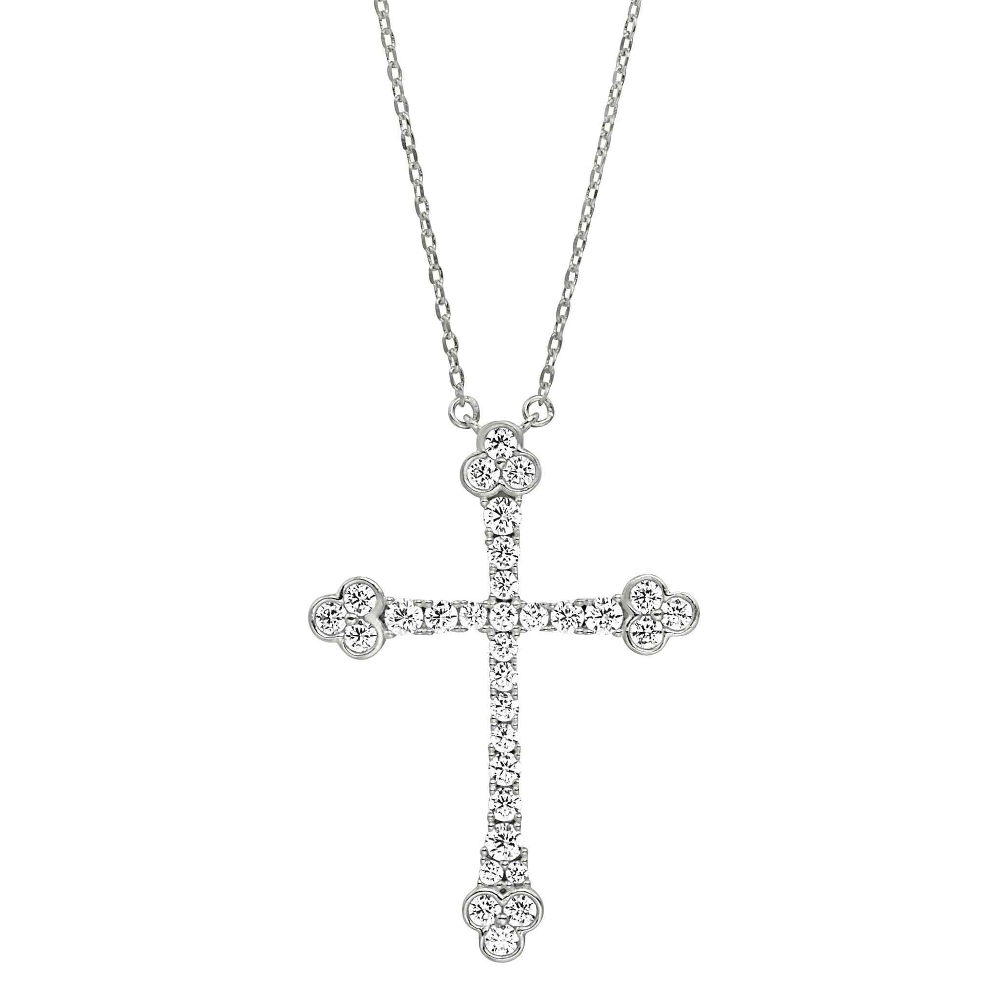 A cross necklace with triple simulated diamond accents displayed on a neutral white background.