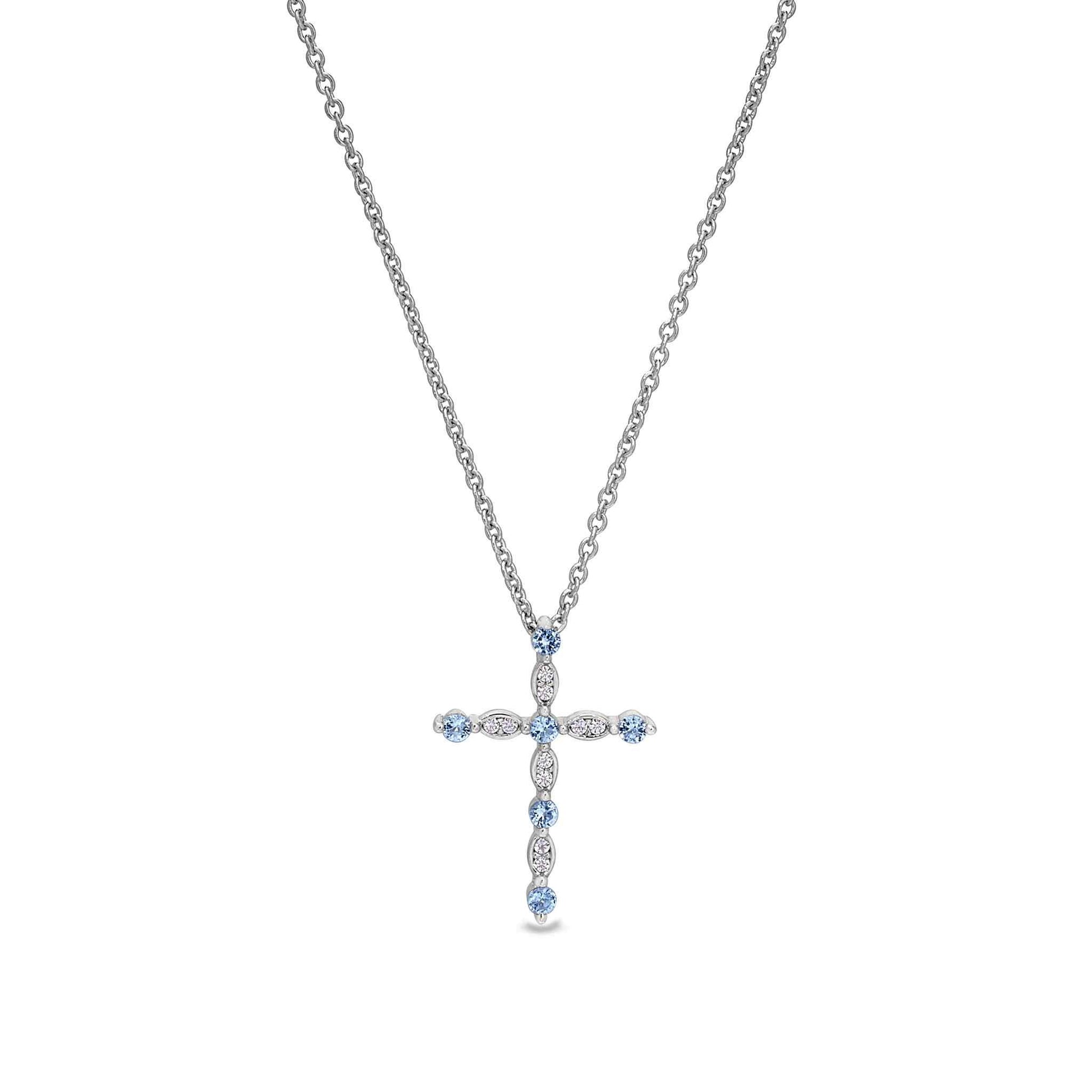 A cross necklace with simulated diamonds displayed on a neutral white background.