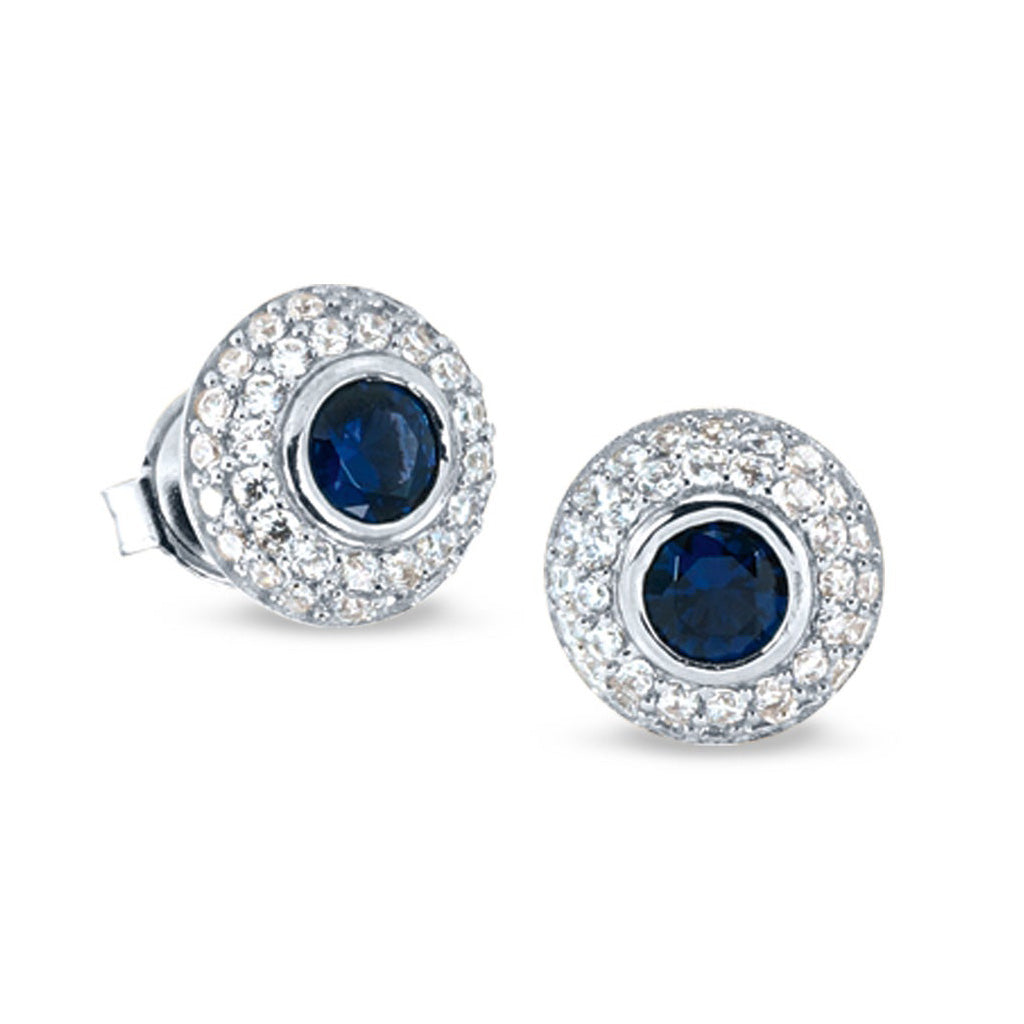 A earrings with synthetic blue sapphire and simulated diamonds displayed on a neutral white background.
