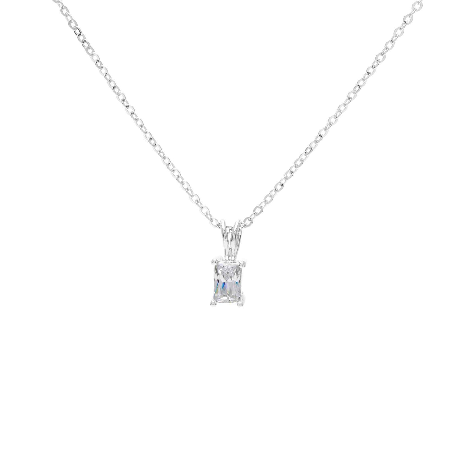 A emerald cut simulated diamond necklace displayed on a neutral white background.