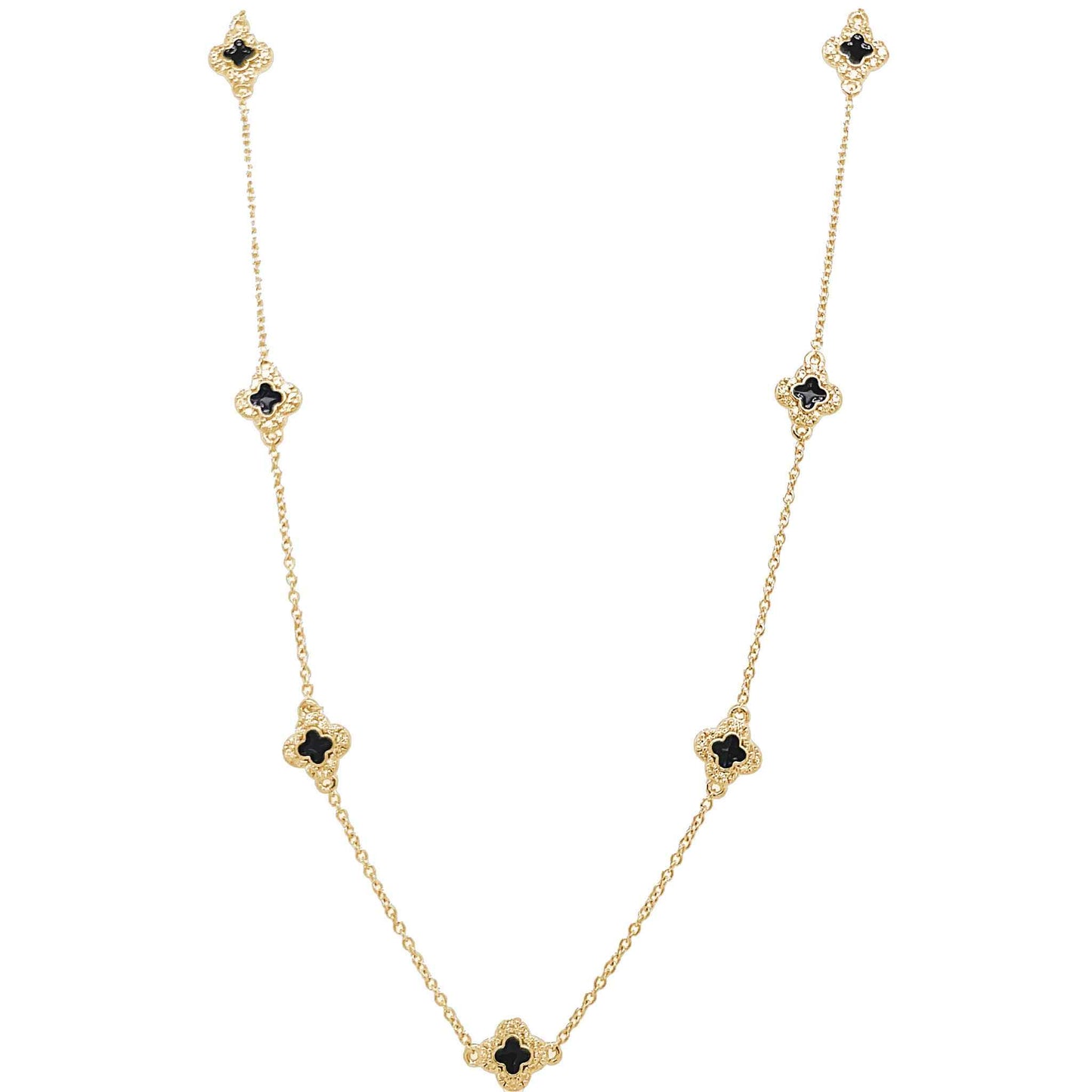 A enamel clover station necklace with simulated diamonds displayed on a neutral white background.