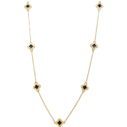 A enamel clover station necklace with simulated diamonds displayed on a neutral white background.