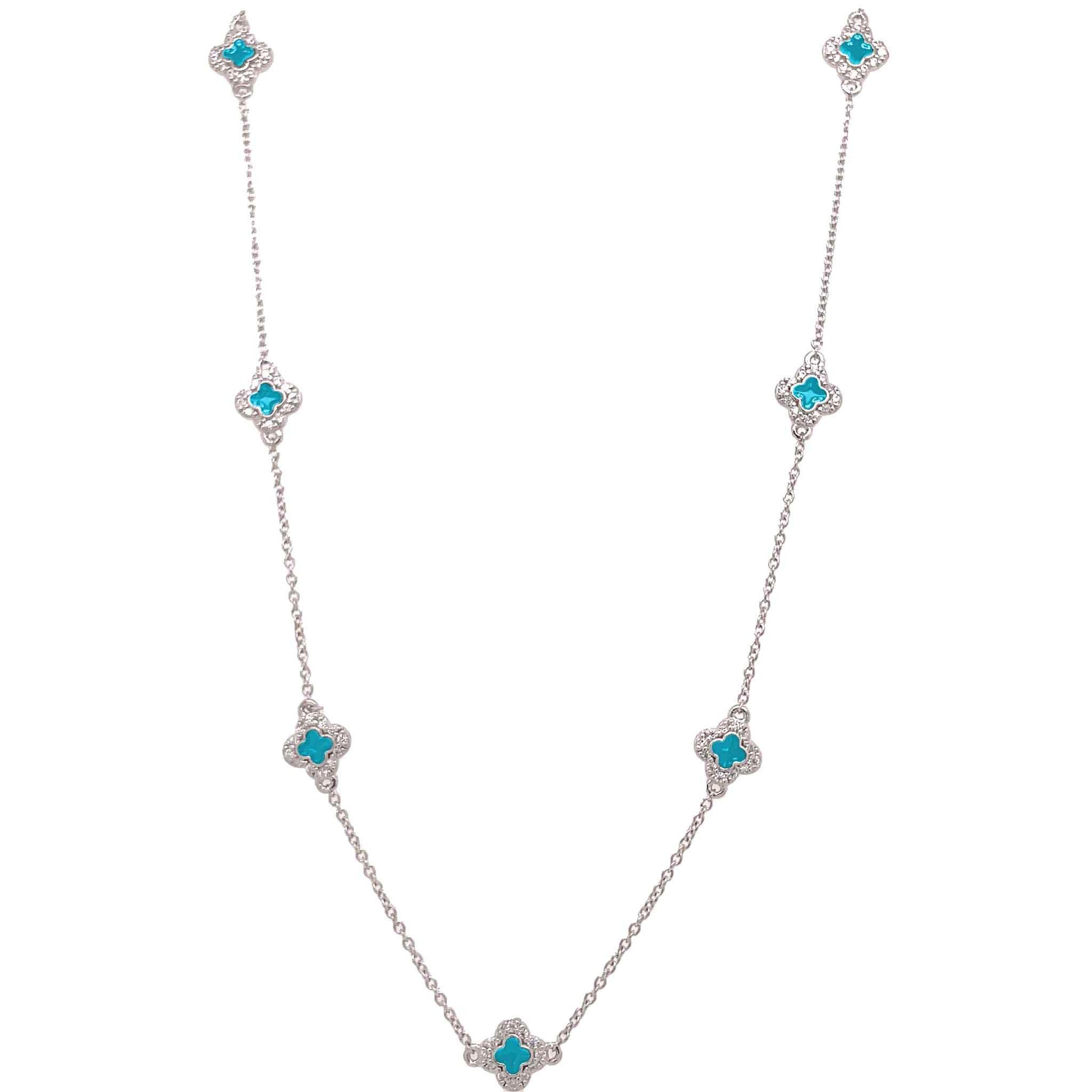 A enamel clover station necklace with simulated diamonds displayed on a neutral white background.