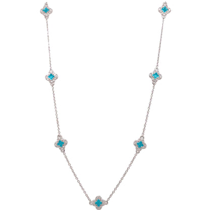 A enamel clover station necklace with simulated diamonds displayed on a neutral white background.